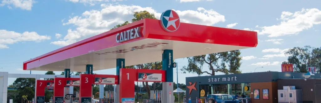 Caltex petrol station in Shepparton with red canopy, fuel pumps, and price board
