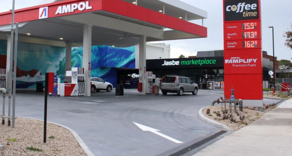 Ampol petrol station forecourt in Frankston with Jasbe Marketplace and Coffee Time signage