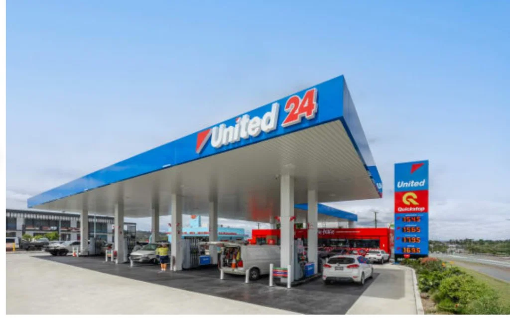 United 24 petrol station in Werribee with blue canopy, fuel pumps, price board, and Quickstop convenience store